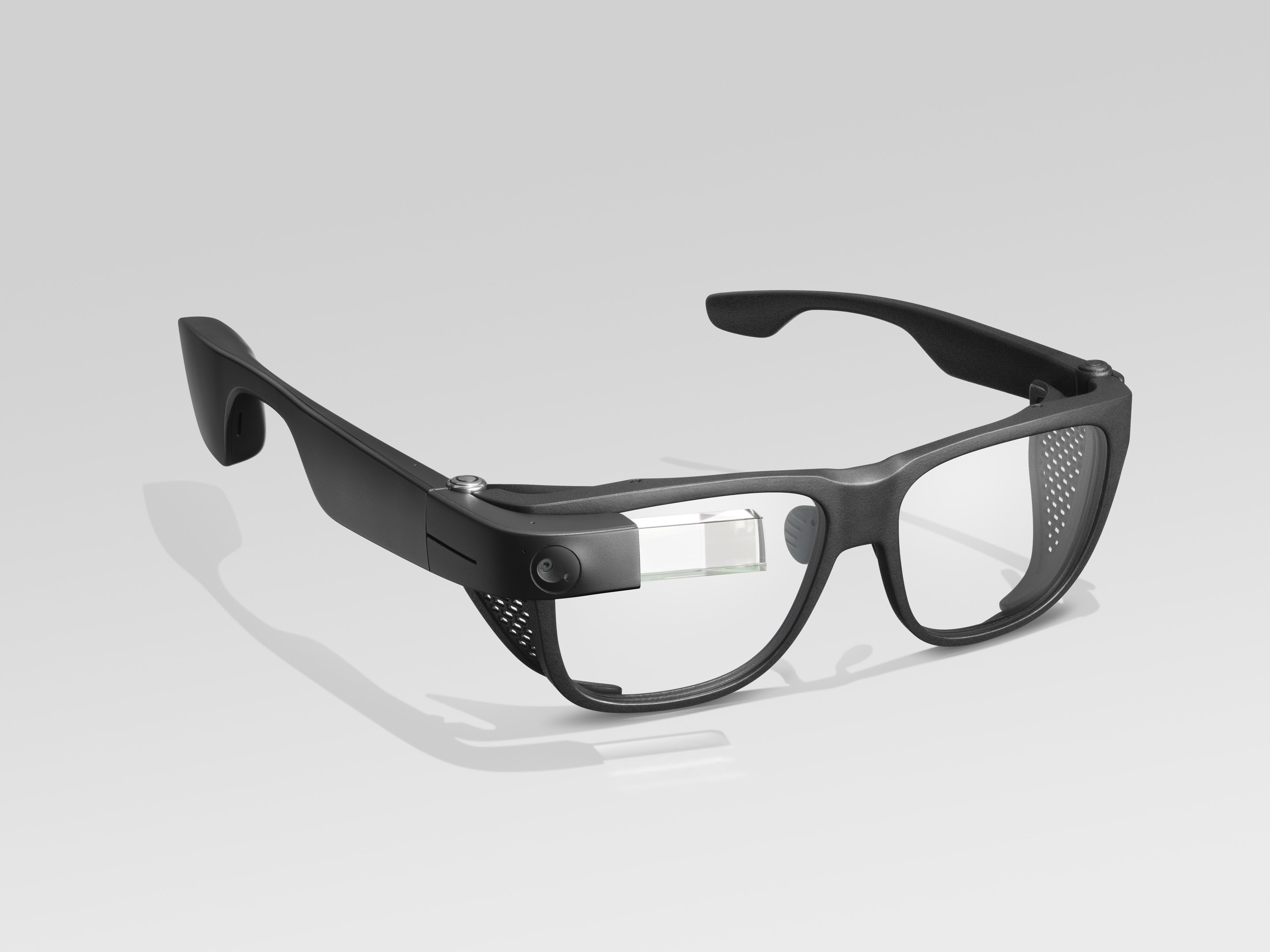 Photo of Envision Glasses with the Smith Optics frames; the frames are black plastic, 2 or 3 times thicker than the titanium frames